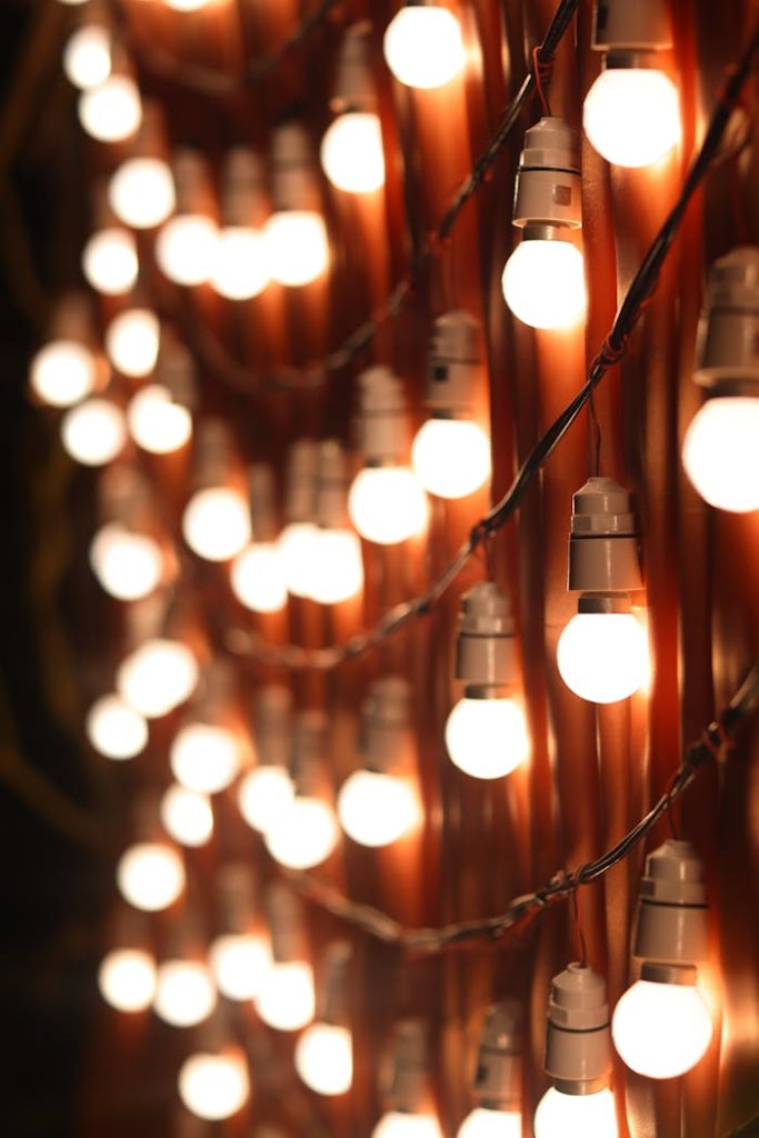 Close-up of warm glowing string lights creating a cozy ambiance at night.
